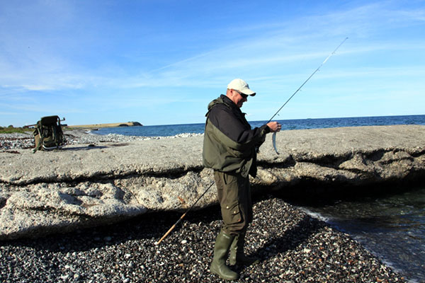 Lystfisker på stranden